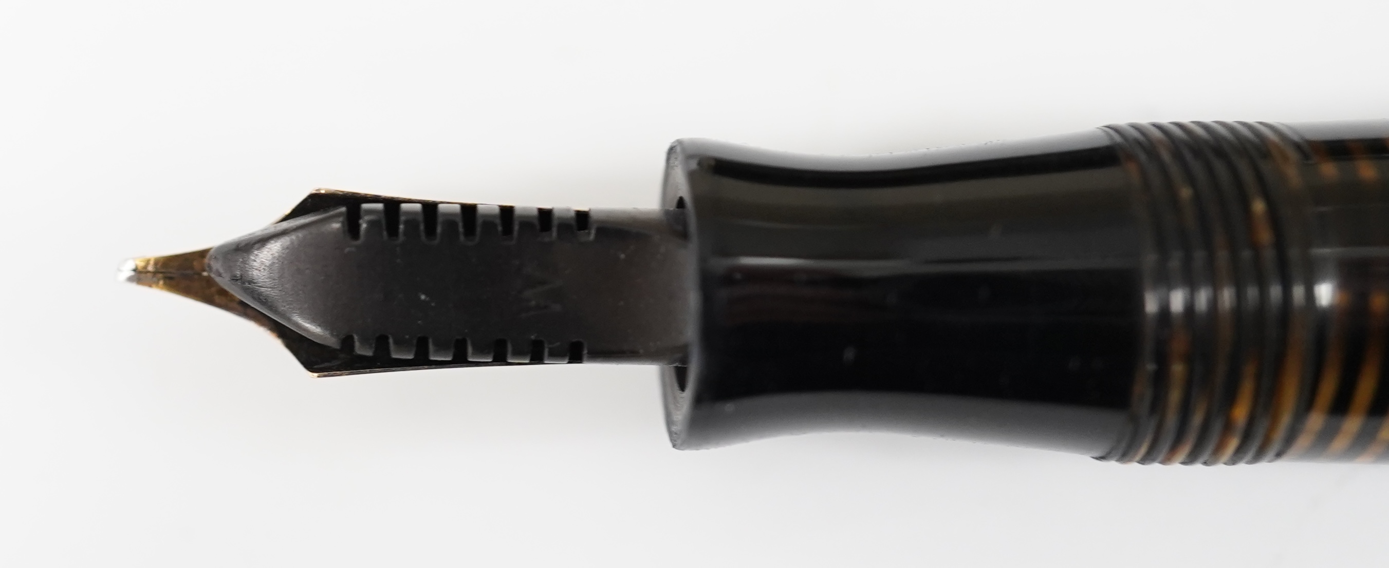 A Parker Vacumatic in brown with rare wide cap band